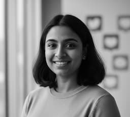 Sana, Community Manager, candid portrait with smartphone.